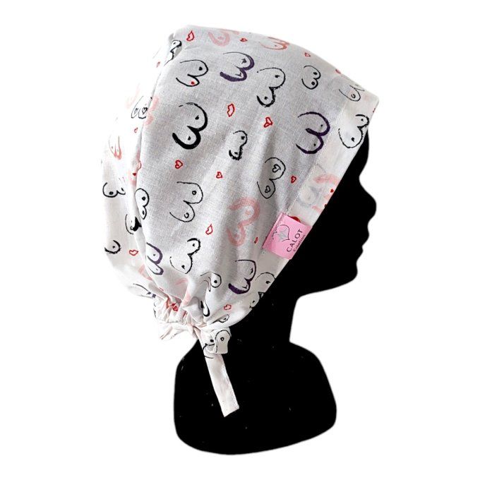 son fond blanc est sublimé par des motifs artistiques de poitrines esquissées en noir, rose et viole
