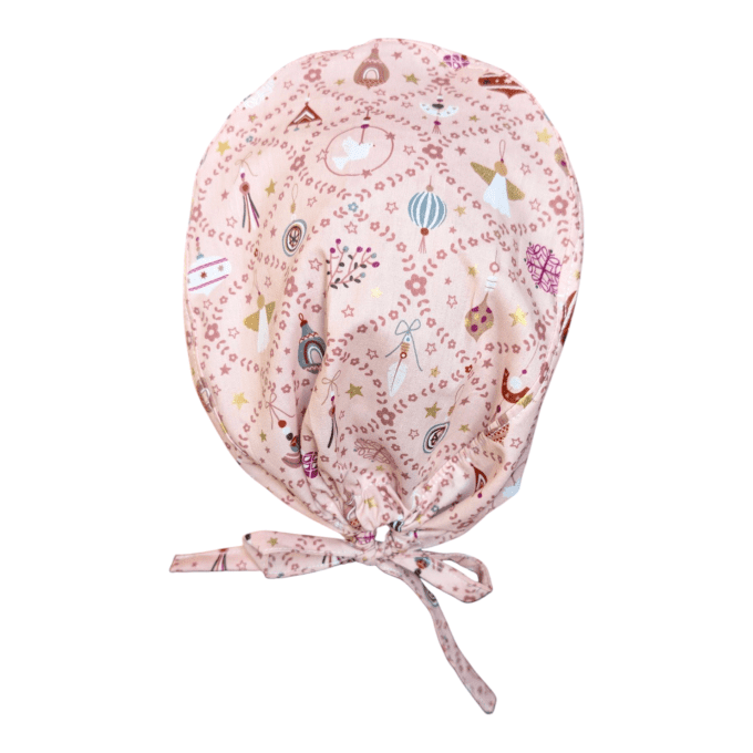ses motifs dorés et rouges sur fond rose évoquent la beauté de l’hiver et la magie des fêtes, tout e