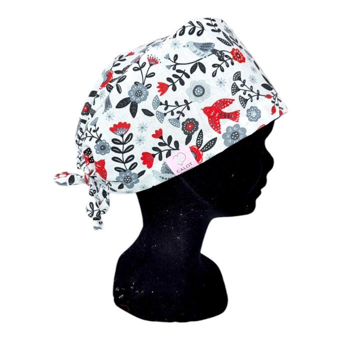 des colombes rouges, des fleurs rouges, grises et noires et un feuillage raffiné sur fond blanc text