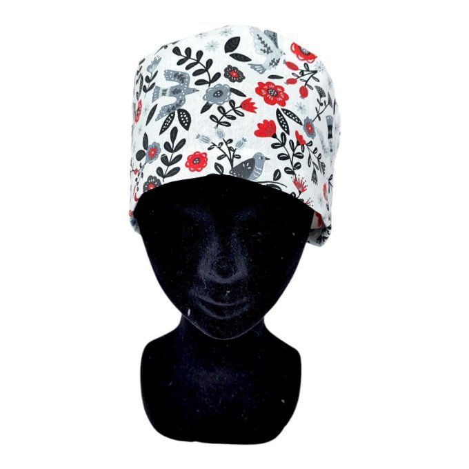 des colombes rouges, des fleurs rouges, grises et noires et un feuillage raffiné sur fond blanc text
