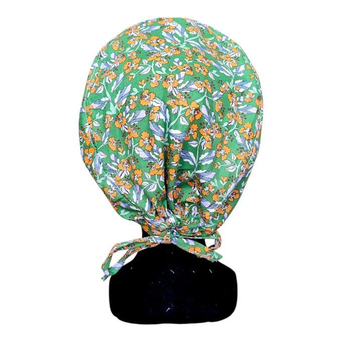 son motif végétal mêlant de petites fleurs orange et feuilles lavande sur fond vert vif apporte une 